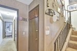 Entryway, stairs to second floor and hall to downstairs bedrooms